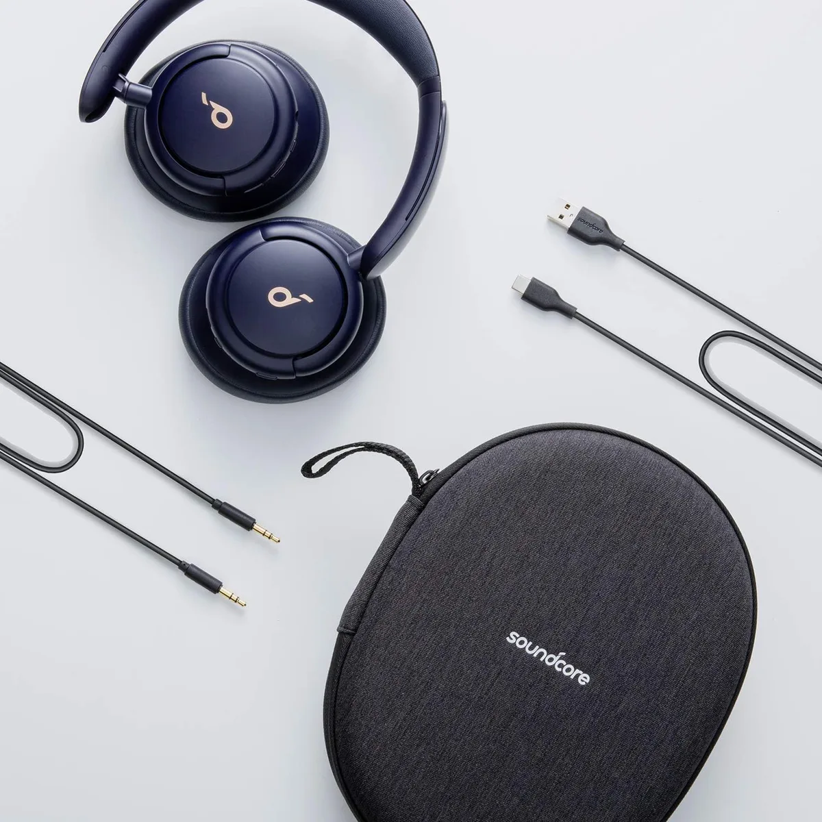 Anker Soundcore Q30 full kit: headphones, carrying case, USB-C cable, and audio cable