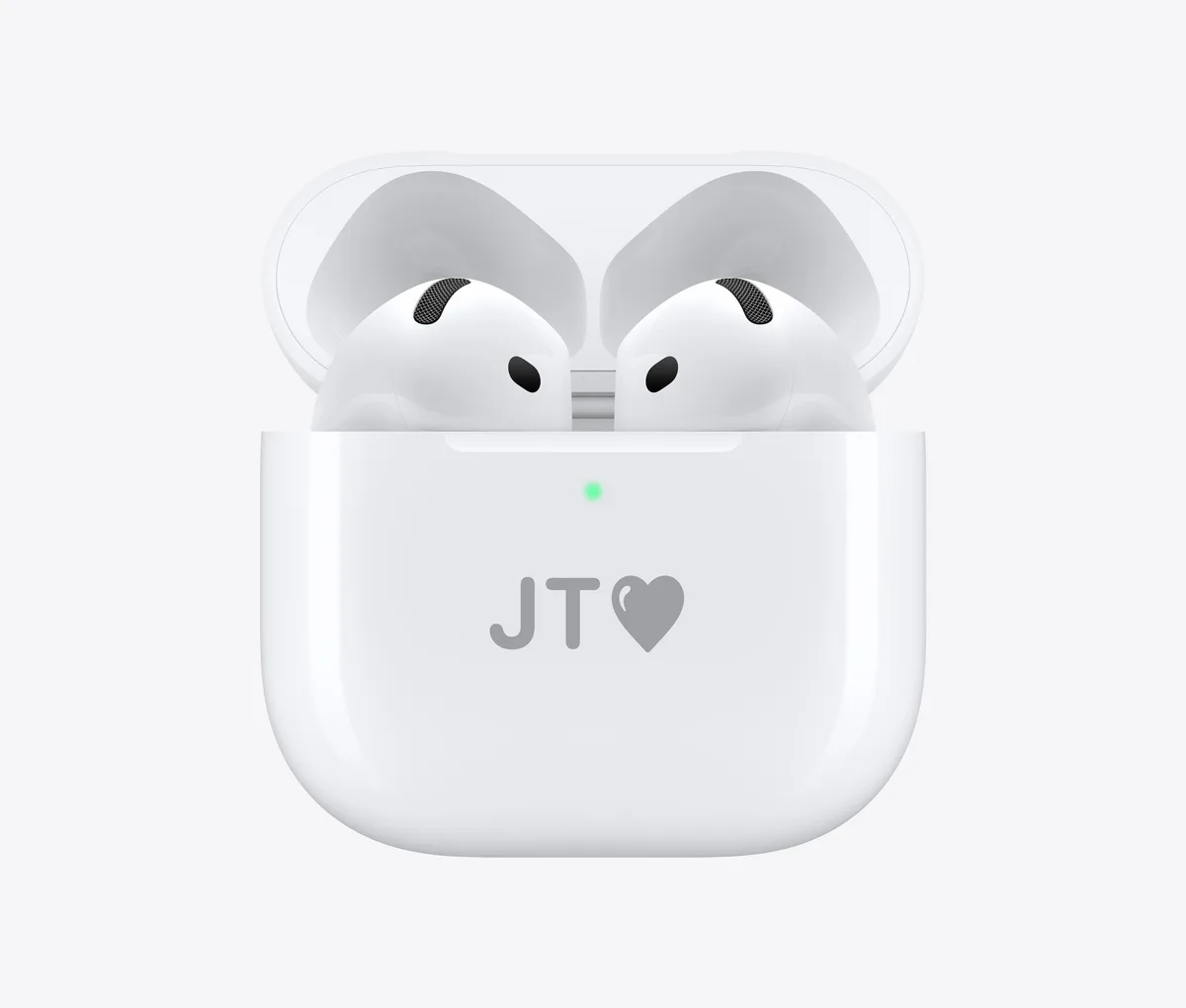 Woman wearing AirPods 4 silhouette against warm orange light