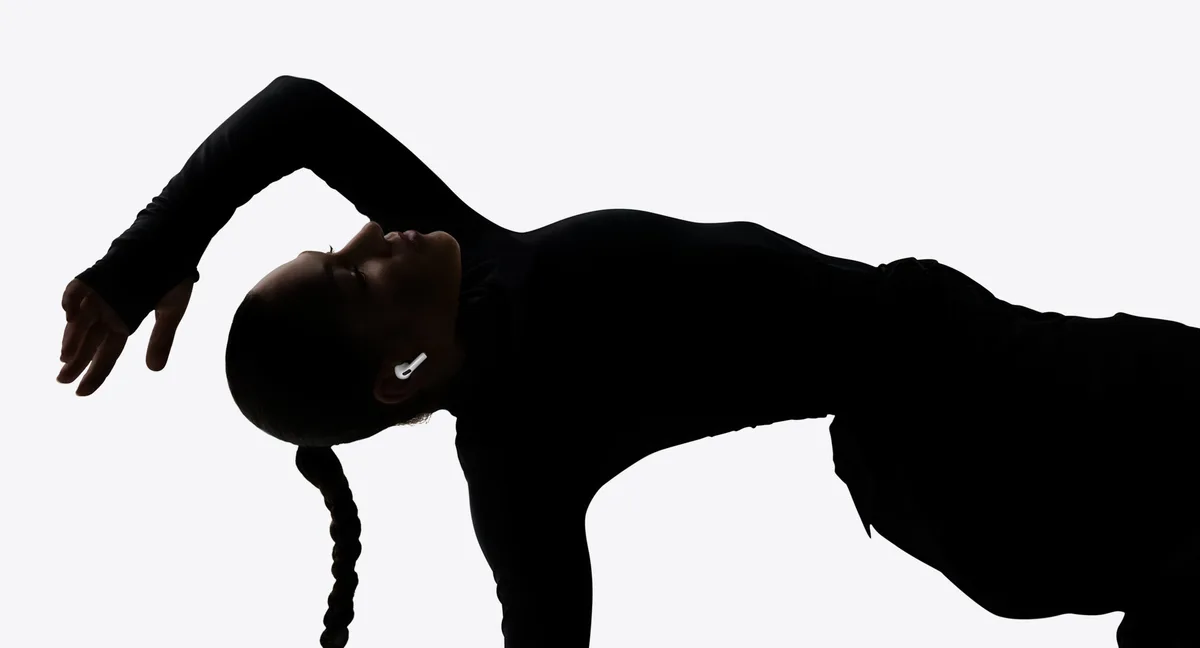 Dancer silhouette wearing AirPods Pro 3 showcasing acoustic performance