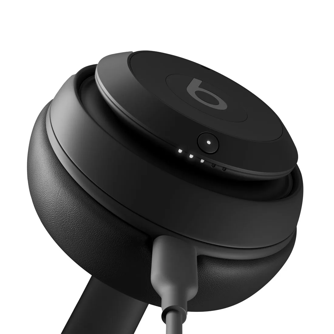 Beats Studio Pro earcup close-up showing USB-C charging port and LED indicators