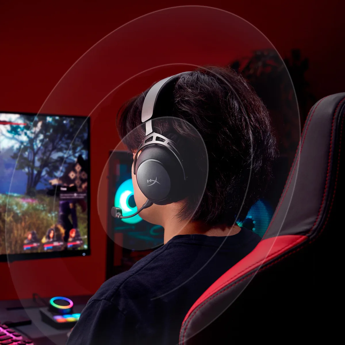 Gamer wearing HyperX Cloud Alpha Wireless during PC gaming