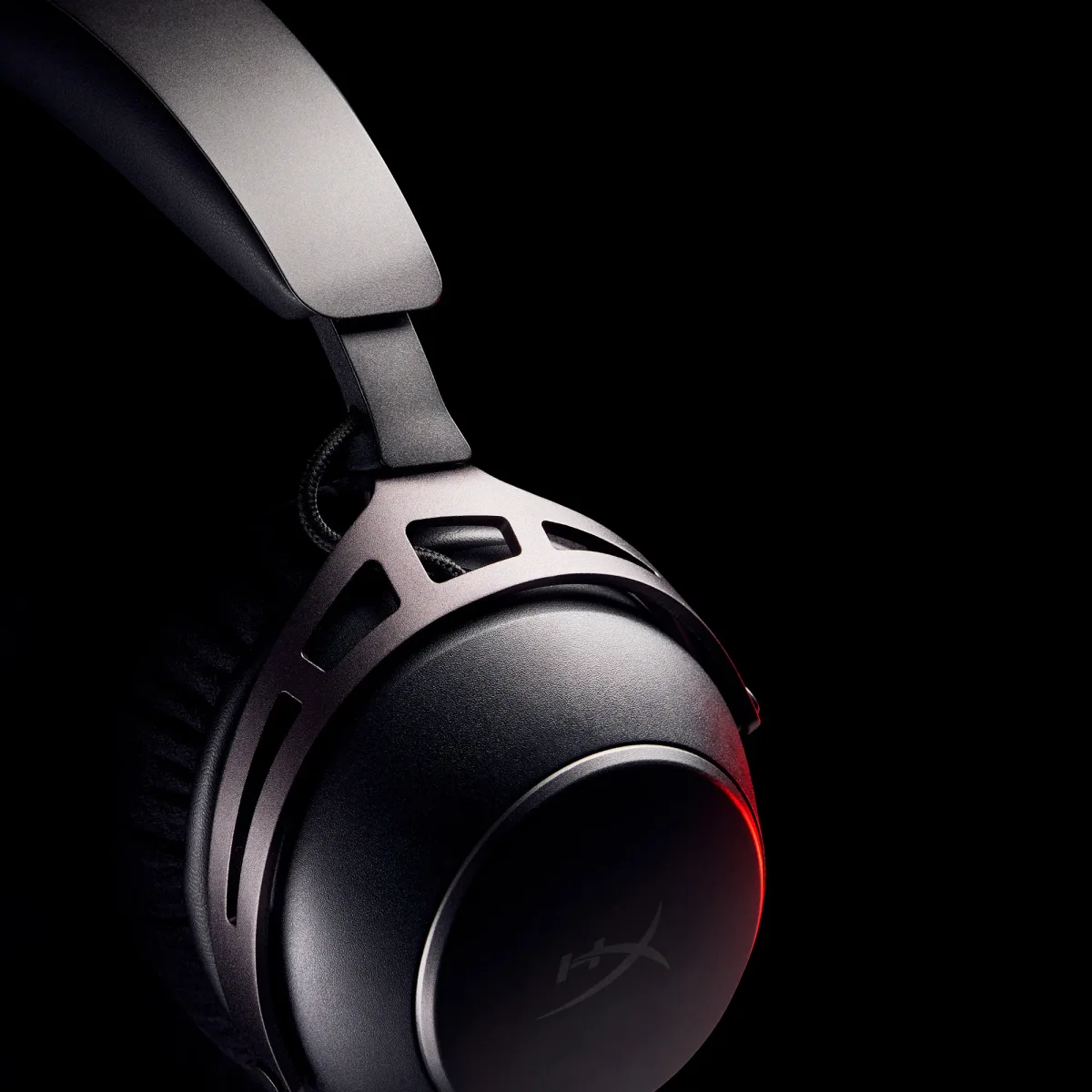 HyperX Cloud Alpha Wireless dramatic earcup close-up in moody lighting