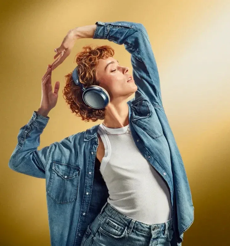 Woman dancing with Sennheiser Momentum 4