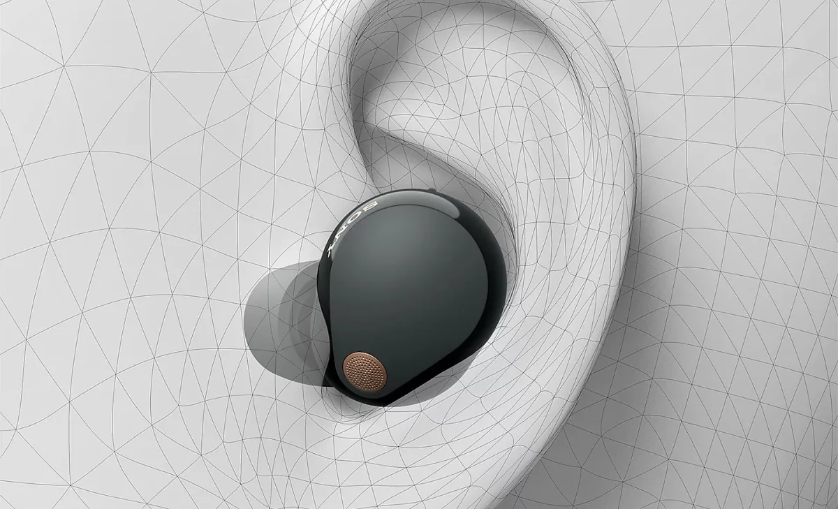 Sony WF-1000XM5 earbud in wireframe ear canal showing ergonomic fit design