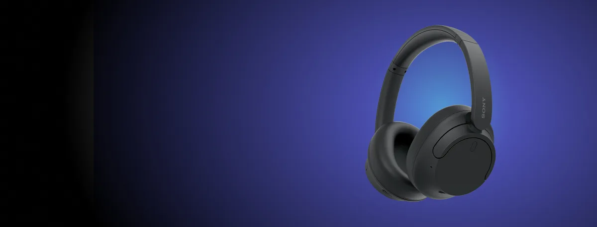 Sony WH-CH720N headphones on dramatic blue-lit backdrop